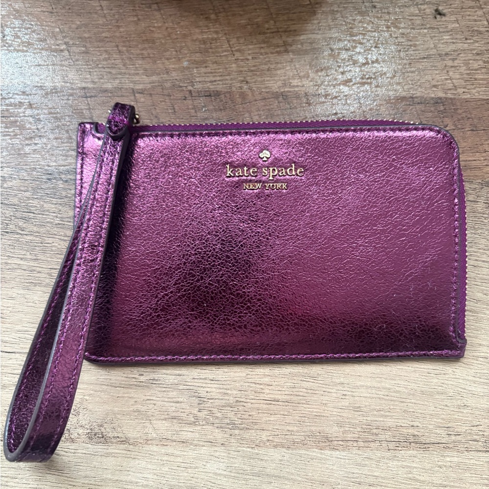 kate spade metallic magenta wristlet with gold logo